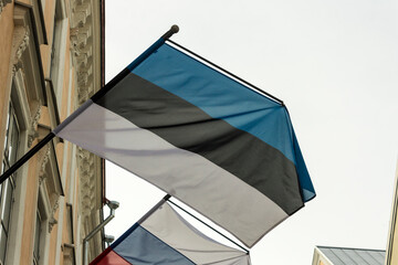 Tallinn, Estonia. Flag of Estonia, with a flag of Russia in the background