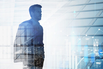 Businessman in night city with financial graph