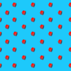 Seamless pattern of red gift box with ribbon on a blue surface