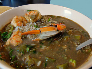 Seafood gumbo with rice, crab and shrimp in a bowl isolated close up