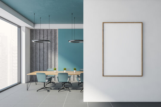 Blue and gray office meeting room with poster