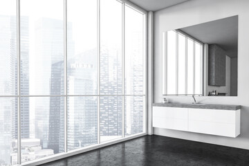 White sink and square big mirror, bathroom with view on the city with skyscrapers