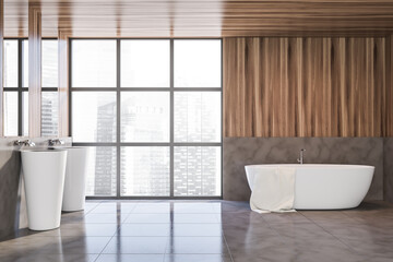 Gray and wooden bathroom with double sink and tub