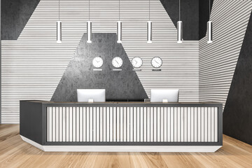 Reception desk in open space lobby with clocks, black and white wall, wooden floor