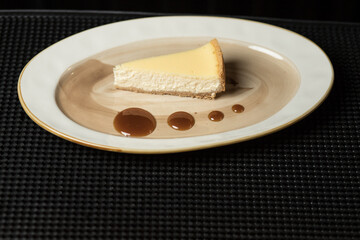 Slice of New York cheesecake with cherry jam