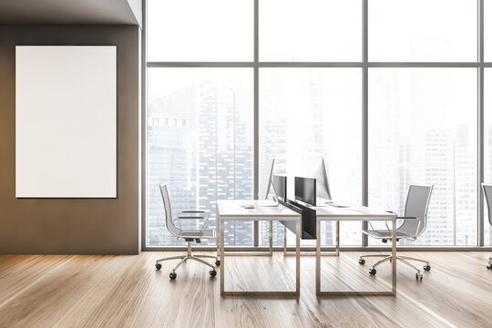 Two tables with computers blank mockup near big window, city view on skyscrapers