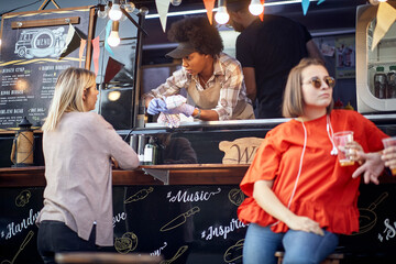 group of people talking, customer with employee, female with a friend