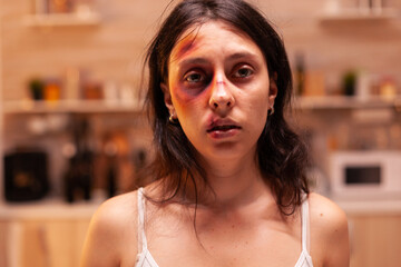 Face of scared woman victim in home after being abused because of agressive. Violent aggressive...
