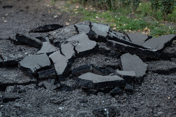 Broken pieces of asphalt road during reconstruction works