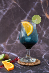 cocktail with lemon and lime