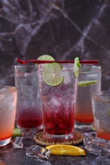 cocktails selection with lemonade and vodka on table background