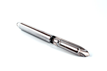 metal kitchen appliance for cleaning vegetables and fruits close-up on a white background