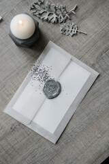 silver seal on the envelope with sequins
