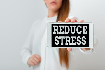 Conceptual hand writing showing Reduce Stress. Concept meaning to lessen the state of mental or...
