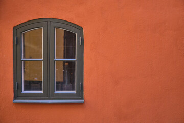 vintage black windows on the orange wall