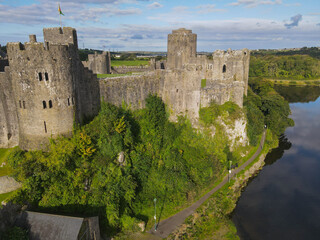 Side View of Pembroke Castle in Pembrokeshire, Wales, UK. This medieval fortress is nearly 1000...