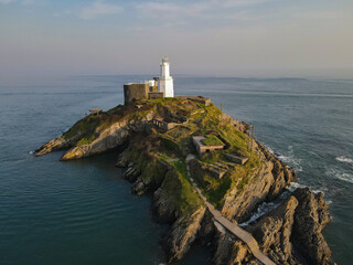 Fototapeta na wymiar The Mumbles Light House, located in Gower near Swansea is located on its own island in the ocean with stunning coastal views. 