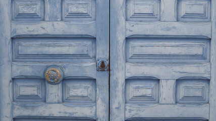 colored wooden doors with metal knobs