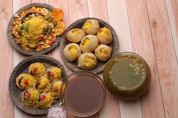 Fototapeta na wymiar group of Bombay chat food includes golgappa/panipuri, bhel-puri, sev-poori.