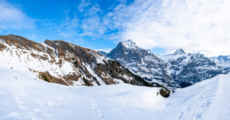 Wide panoramic view of winter landscape in Swiss Alps on the First mountain in Grindelwald,...