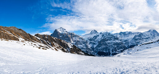 Wide panoramic view of winter landscape in Swiss Alps on the First mountain in Grindelwald,...