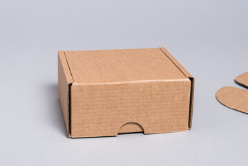 Brown cardboard box on grey background