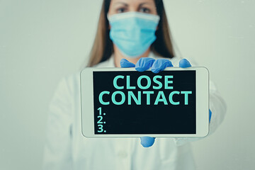 Writing note showing Close Contact. Business concept for having a history of direct exposure to a...
