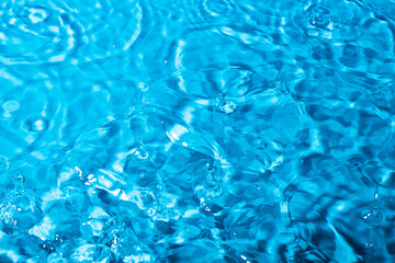 splash of water on a blue background. Abstract wallpaper