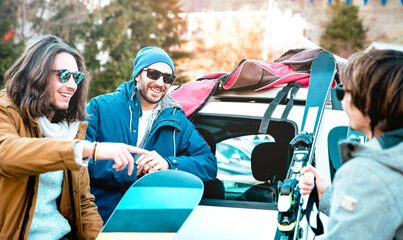 Best friends having fun together with ski and snowboard at mountain roadtrip - Winter sport concept...