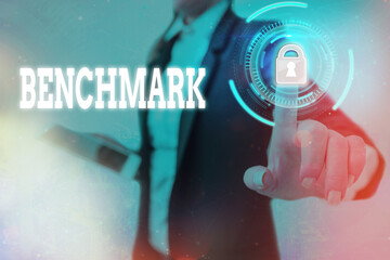 Text sign showing Benchmark. Business photo text something that serves as a standard by which...