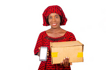 Fototapeta premium portrait of smiling african woman holding a delivery carton and