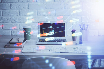 Double exposure of desktop computer and technology theme hologram. Concept of software development.