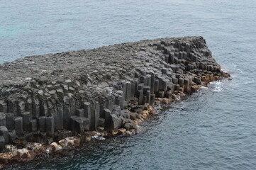 Fototapeta premium Exploring the waterfalls and coastal landscapes of the Jeju Island in South Korea