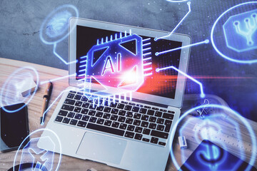 Double exposure of desktop computer and technology theme hologram. Concept of software development.