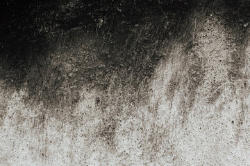 Grey textured wall, dark and light background. Grey and black.
