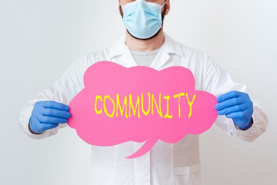 Text sign showing Community. Business photo showcasing group of showing with a common characteristics living together Laboratory Technician Featuring Empty Sticker Paper Accessories Smartphone