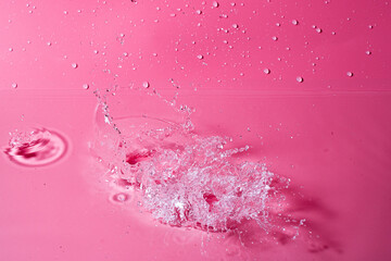 splash of water on a red background. Abstract wallpaper