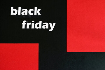 Fototapeta na wymiar Advertising of selling event Black Friday on the black-red background with space for your text.