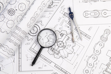 Industrial chain drawings, engineering compass and magnifying glass