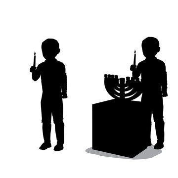 A black silhouette of a Jewish boy holding a large candle in his hand and lighting Hanukkah candles. A menorah is placed on the table.
Vector drawing.