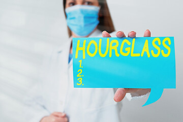 Conceptual hand writing showing Hourglass. Concept meaning instrument for measuring time consisting...