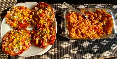 Home made wheat pasta penne in red sauce and wheat pizzas