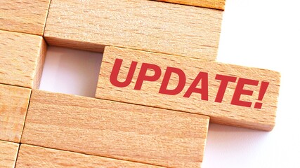 UPDATE word written on wood block. UPDATE text on table, concept.Business photo text make something more modern or up to date like software program.
