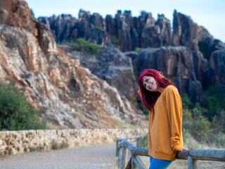 Closeup shot of a beautiful young lady with red hair in Cerro del Hierro, Sevilla, Spain