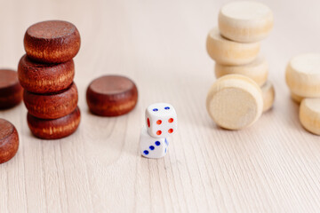 Dice and chips on wooden background. Concept of board games