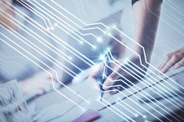 Double exposure of woman's writing hand on background with data technology hud. Big data concept.
