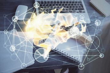 Multi exposure of writing hand on background with brain hologram. Concept of learning.