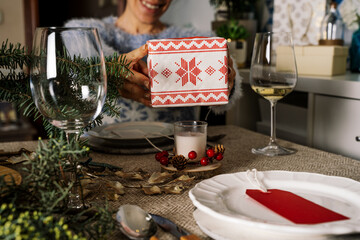 Happy family opening christmas presents, sisters give each other gifts at the  christmas table, Family Together Christmas  Concept.