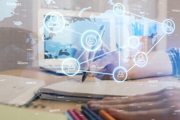 Social network theme hologram over woman's hands writing background. Concept of international people connect. Double exposure