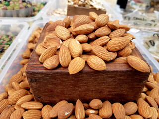 Almonds in wooden boxes put on the market
